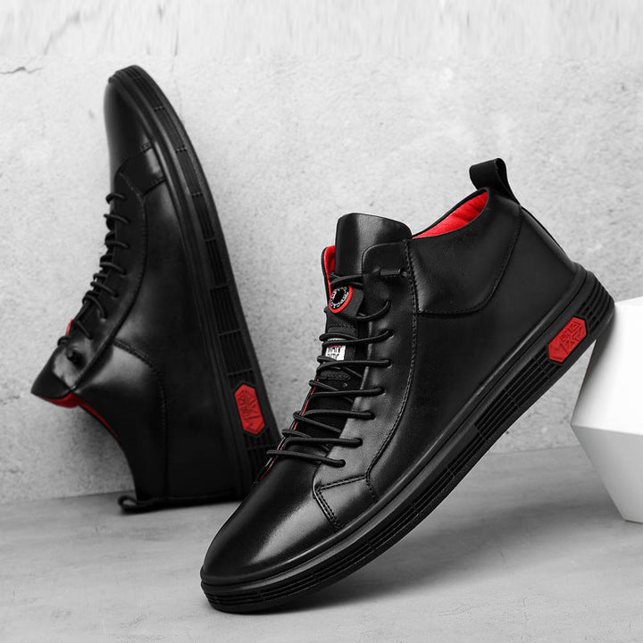 Modern high-top men's sneakers featuring bold red accents, ideal for casual and fashion-forward looks.