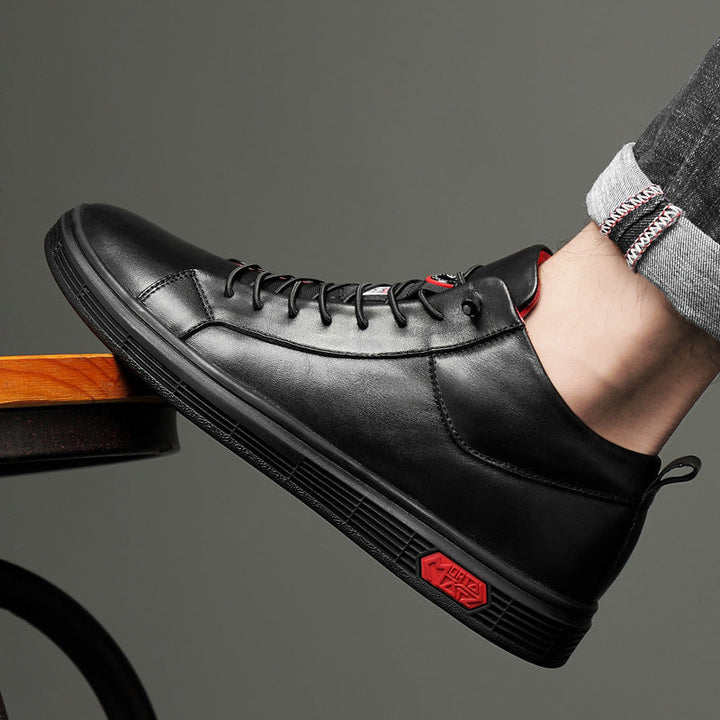 Fashion-forward men's high-top sneakers, black with eye-catching red accents, great for streetwear.