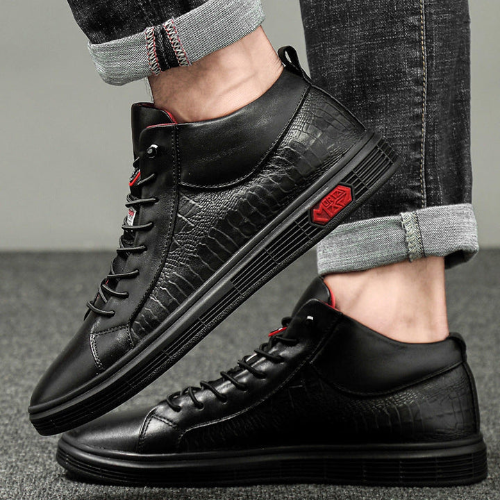 Urban men's high-top casual shoes in black, accented with bright red details for a modern look.
