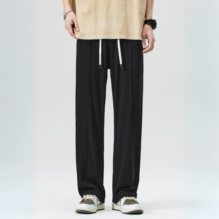 Green men's pleated trousers, versatile and stylish, suitable for casual or business casual outfits.
