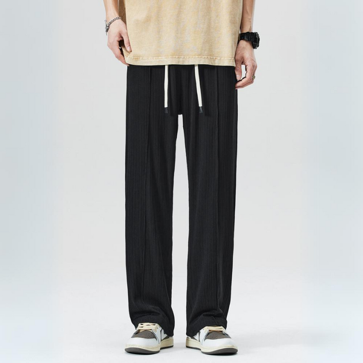 Green men's pleated trousers, versatile and stylish, suitable for casual or business casual outfits.