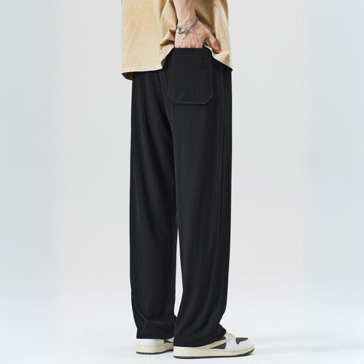 Stylish men's pleated trousers featuring elastic waist for comfort & a modern casual look.
