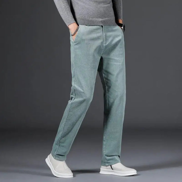 Full shot of modern fit men's pants, showcasing their sleek tailored design and comfort.