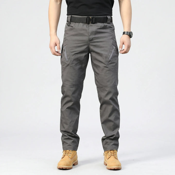 Men's utility cargo pants with 9 versatile pockets, ideal for workwear, outdoor activities & tactical use.