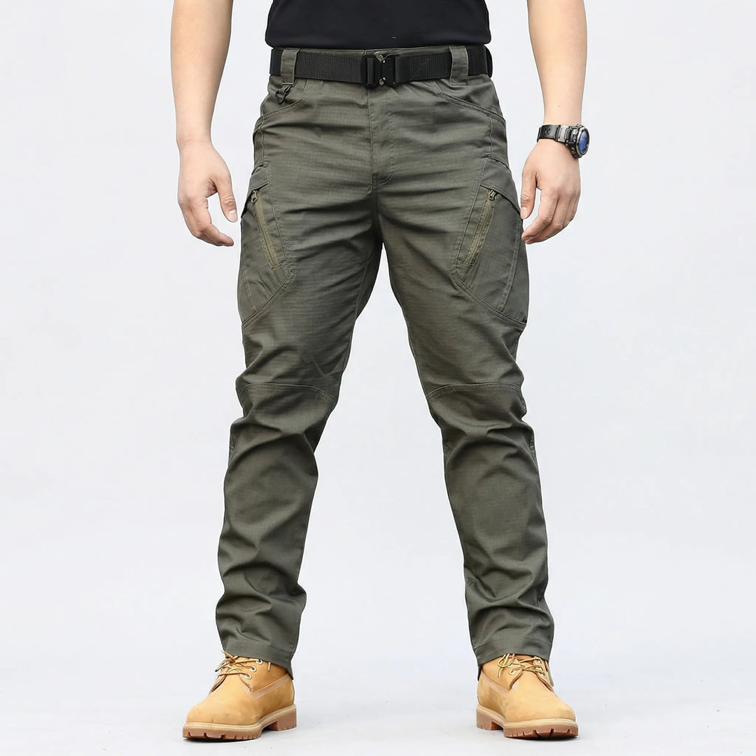 Flexible men's tactical cargo pants for outdoor adventure, featuring 9 durable multi-purpose pockets.