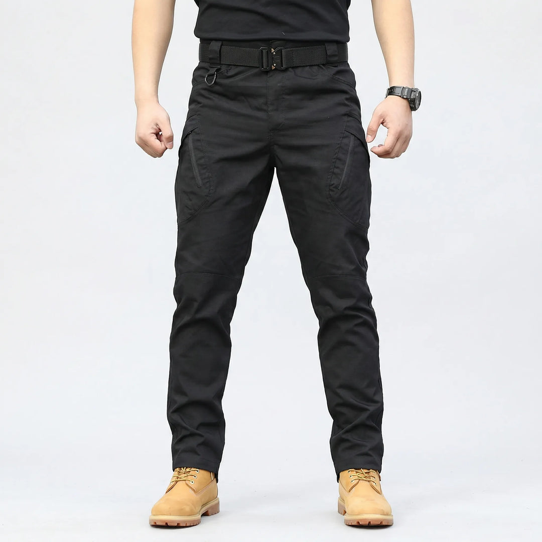 Close-up of men's tactical cargo pants showing 9 utility pockets and durable fabric for rugged use.