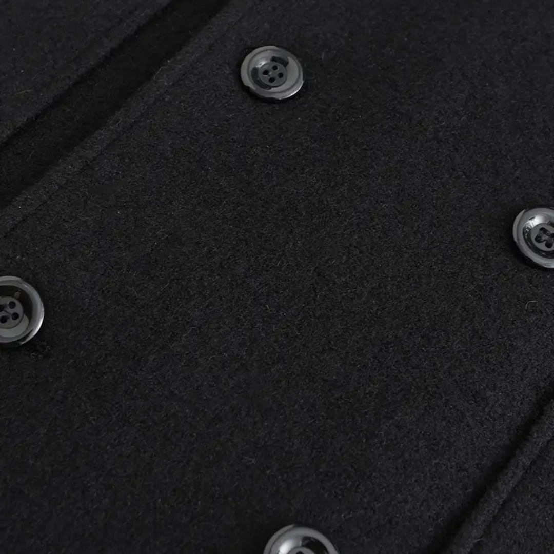 Tailored men's black double-breasted overcoat. Elegant long winter coat, perfect for business or formal events.