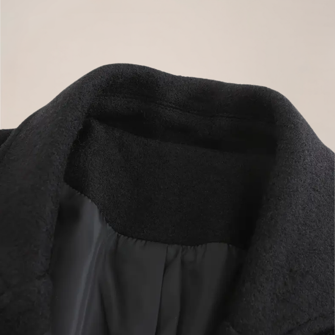 Black double-breasted men's overcoat. A timeless long winter coat for smart business and sophisticated style.