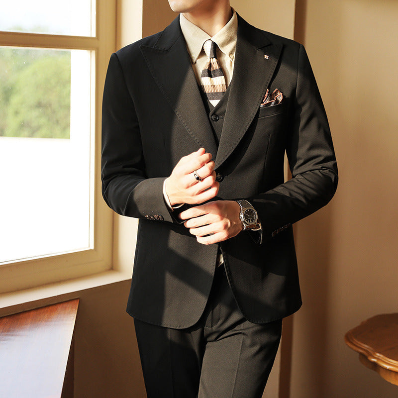 Elegant men's three-piece wedding suit. Tailored slim fit jacket, vest & trousers.