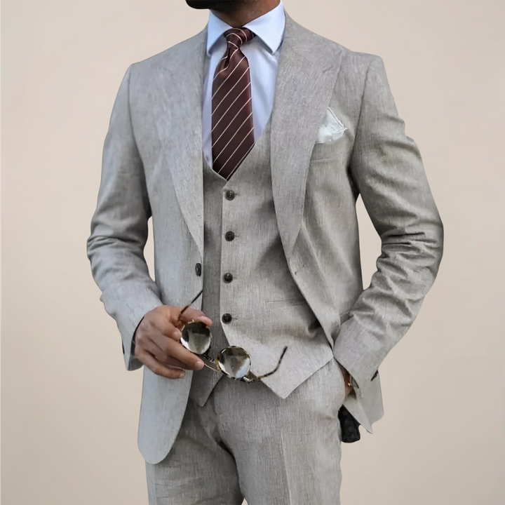 Men's tailored three-piece suit for formal occasions. Includes a sophisticated blazer, waistcoat, and trousers.