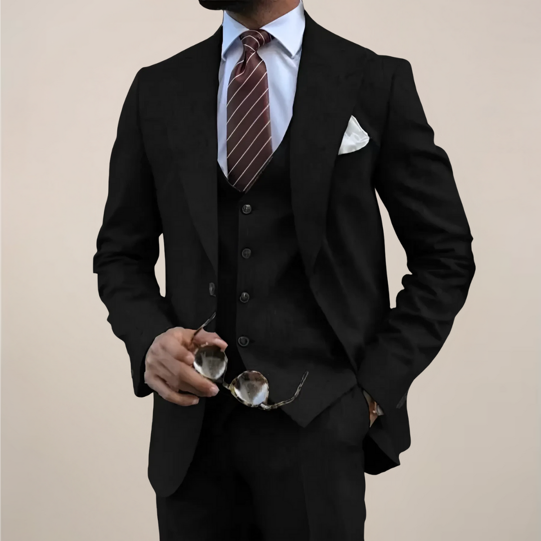 Tailored men's three-piece suit featuring a sharp blazer, matching waistcoat, and trousers for event wear.