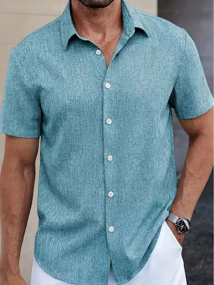 Classic men's short sleeve textured polo, regular fit, solid color, ideal for everyday spring/summer comfort.