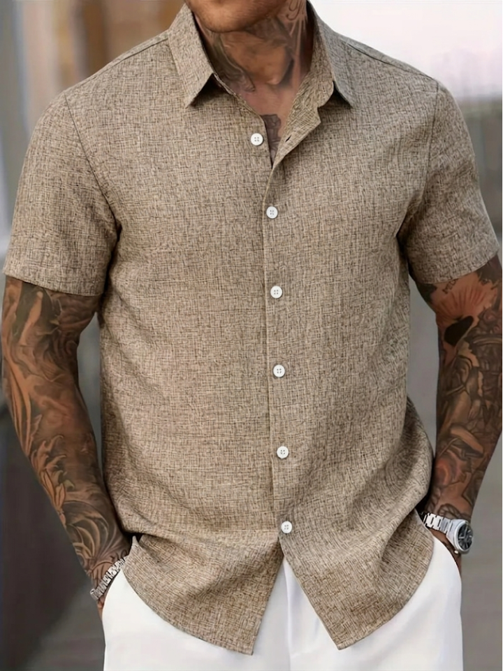 Comfortable men's regular fit textured polo, solid color, short sleeve button-down for effortless spring style.
