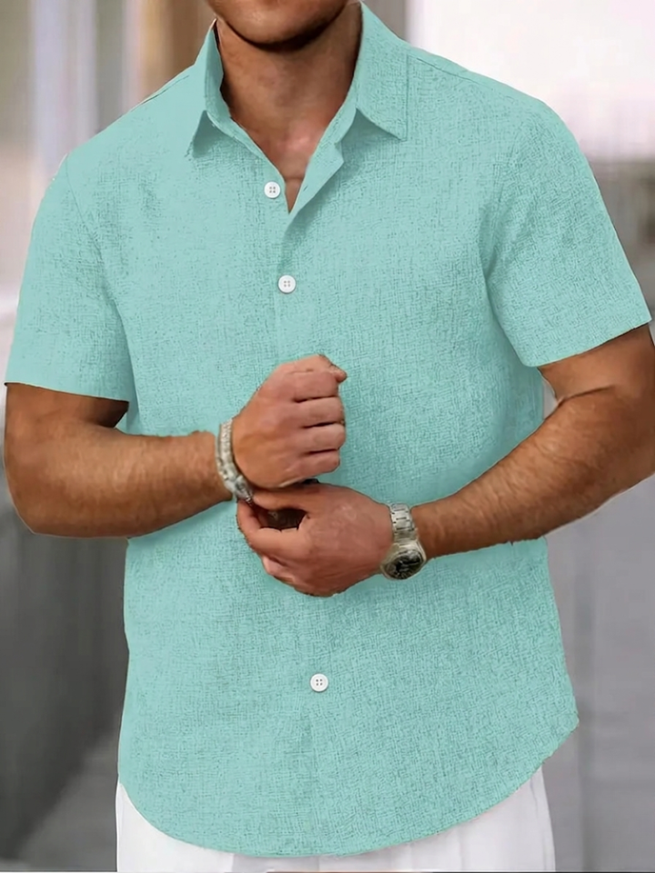 High-quality men's textured polo, regular fit, short sleeve, button-down shirt, essential for casual warm weather.