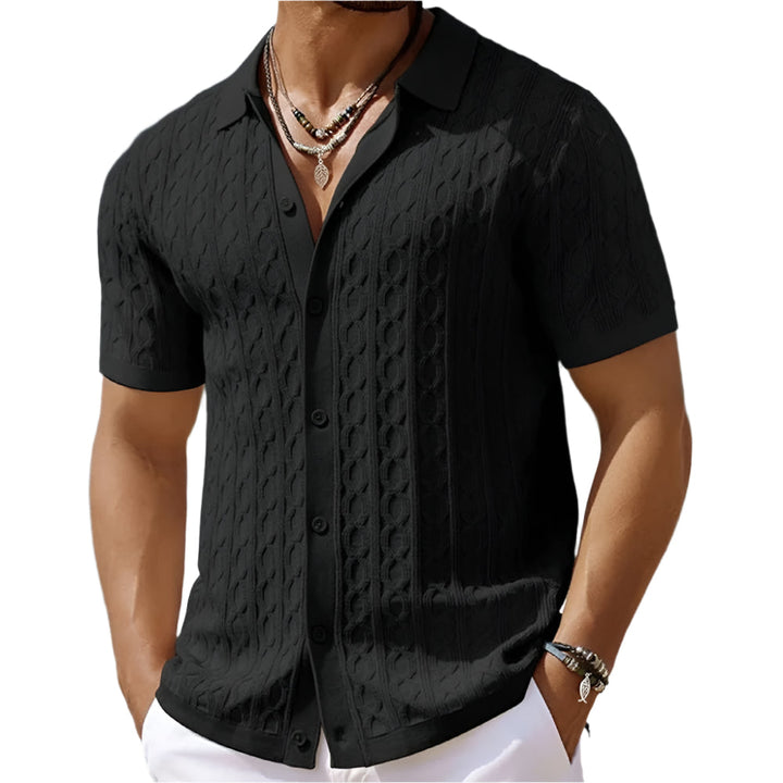 Close-up of men's textured polo shirt fabric. Features a crisp button-down collar and short sleeves.