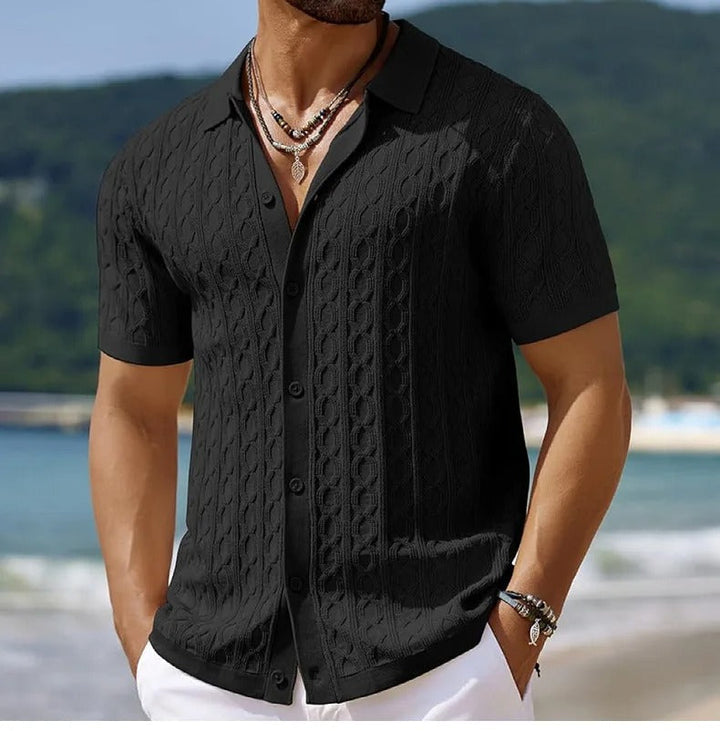 Stylish man wearing a men's short-sleeve textured polo shirt with a smart button-down collar for casual outings.
