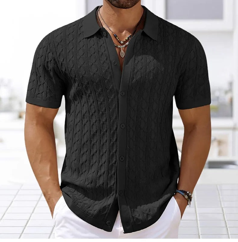 Soft, textured men's polo shirt, short-sleeve design. Elegant button-down collar, ideal for warm weather comfort.