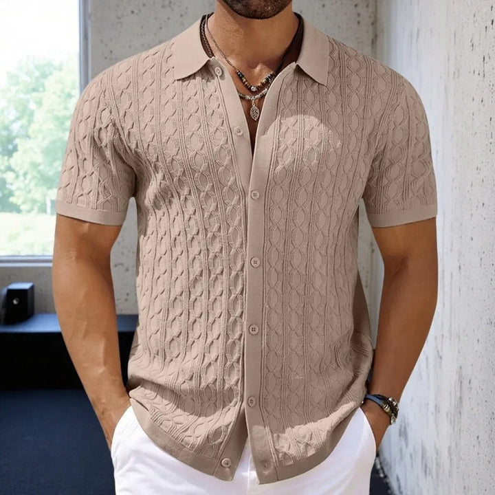 Versatile men's short-sleeve polo shirt with unique texture and a classic button-down collar. Great for summer fashion.