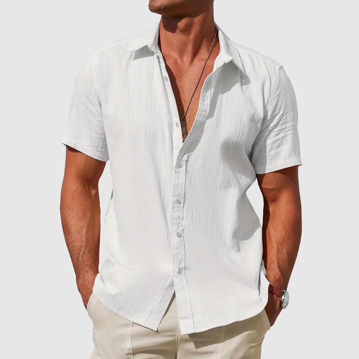 Casual men's short sleeve button top with textured fabric, great for everyday summer outfits.