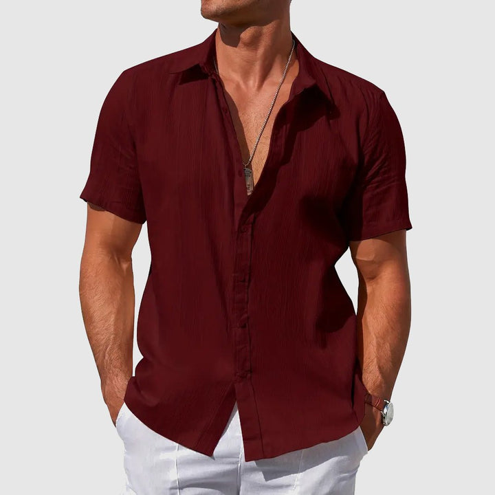 Comfortable men's textured short sleeve button-front top, ideal lightweight everyday wear for summer.