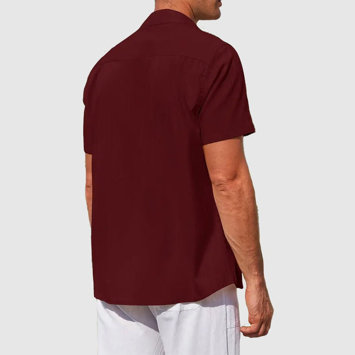 Elevated men's textured short sleeve button top, a stylish casual option for summer days.
