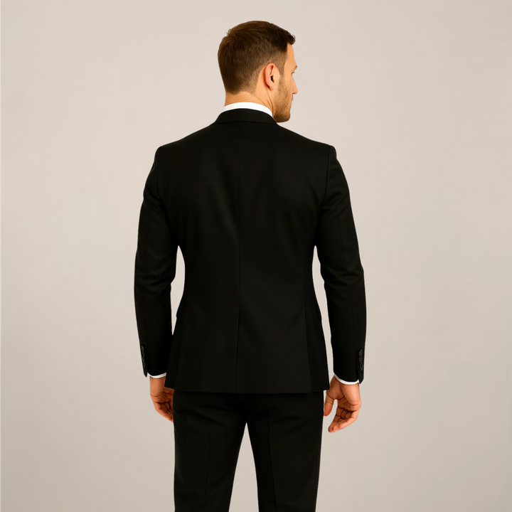 Sophisticated men's three-piece gala dinner suit with elegant contrast lapels, a tailored choice for black-tie weddings.