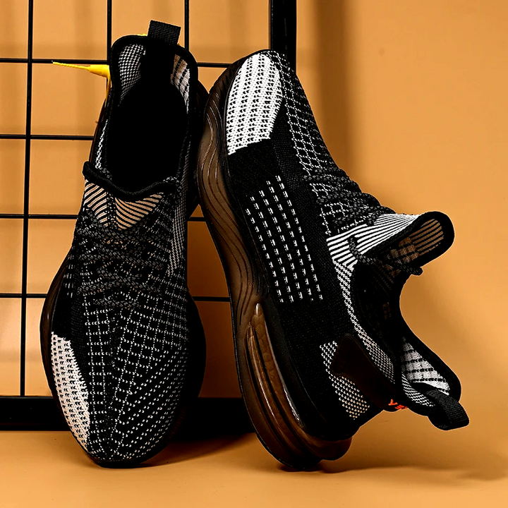 Close-up of men's TrailTrek non-slip grip sole, durable for performance outdoor trail running footwear.