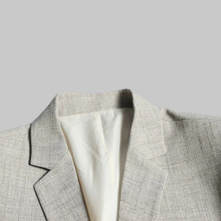 Stylish men's business casual blazer with a two-button closure, single-breasted design, and modern fit.