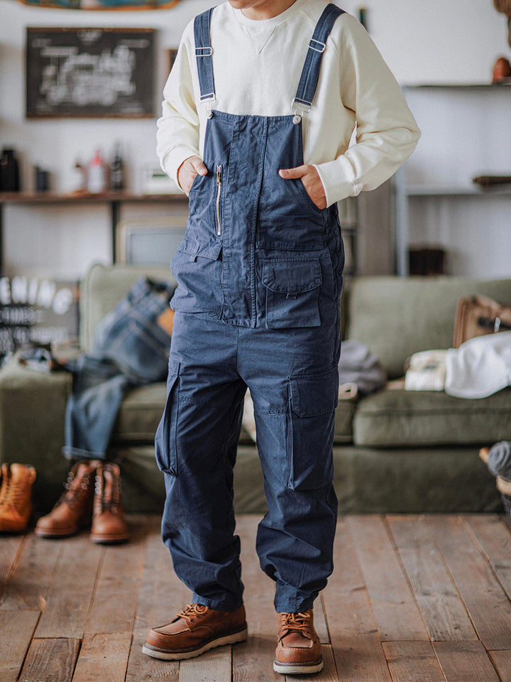 Durable men's cargo bib overalls with multiple pockets, relaxed fit for outdoor work or everyday casual wear.