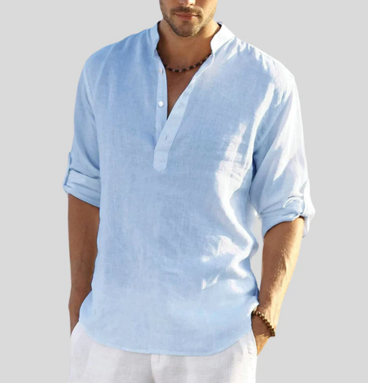 Close-up of a men's V-neck short sleeve button-up summer shirt, showing fabric texture & button detail.