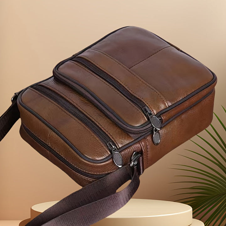 Stylish black shoulder messenger bag for men, featuring an adjustable strap for comfortable wear.