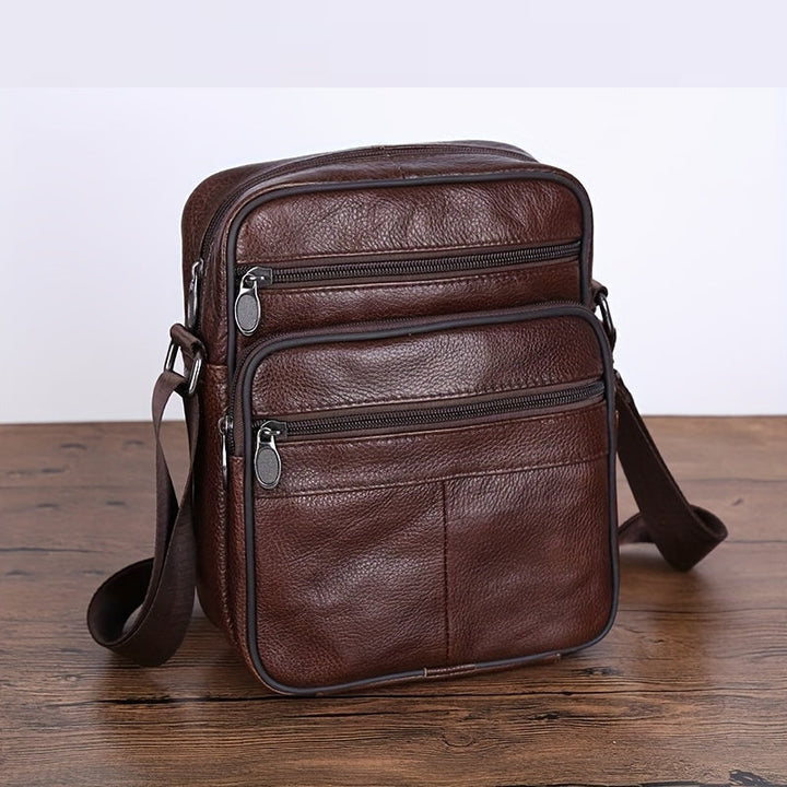 Versatile men's cross-body bag: a spacious & adjustable black messenger, perfect for active lifestyles.