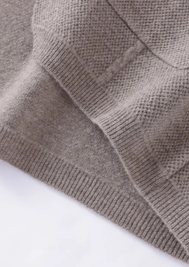 Collared men's button-up cardigan sweater, a modern staple for sophisticated casual mens fashion.