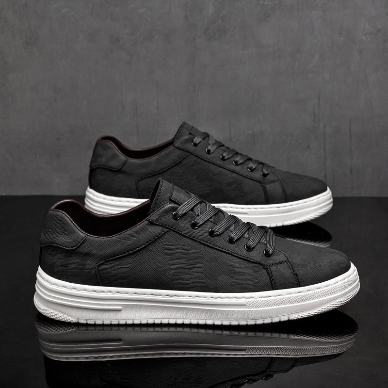 Stylish black men's casual sneakers, lace-up design for modern everyday wear comfort.