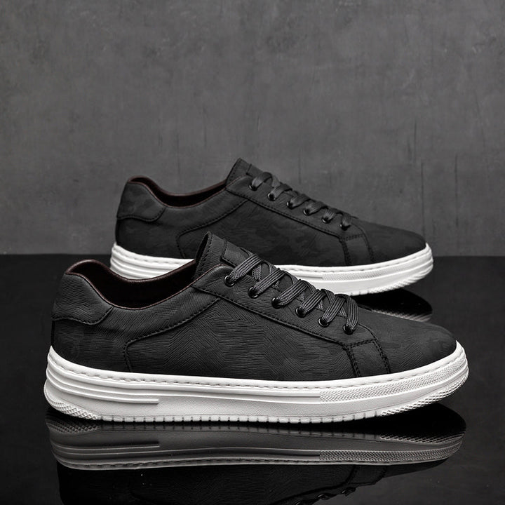Stylish black men's casual sneakers, lace-up design for modern everyday wear comfort.