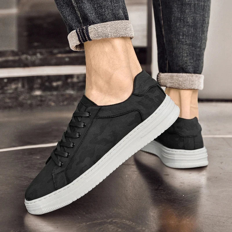 Modern white men's casual sneakers, stylish lace-up design for versatile everyday comfort.