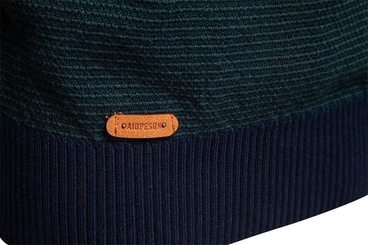 Modern men's half-zip pullover sweater. Stylish long-sleeve knitwear for comfortable versatile fashion.