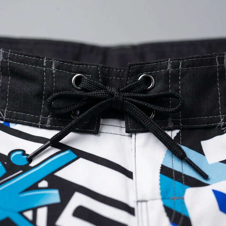 Quick-dry men's printed swim shorts with a vibrant pattern, ideal for active beachwear.
