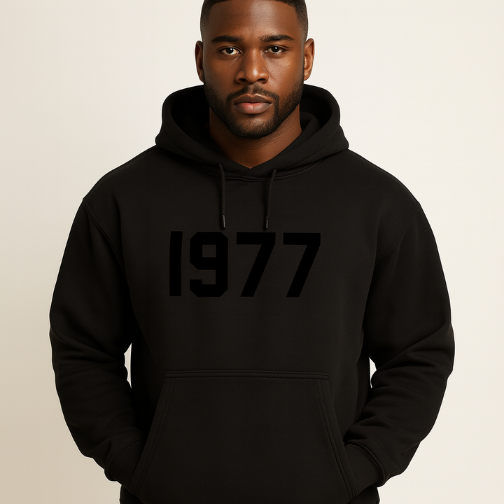 Close-up of men's vintage 1977 streetwear hoodie fabric. Raglan sleeves, cozy pullover texture.