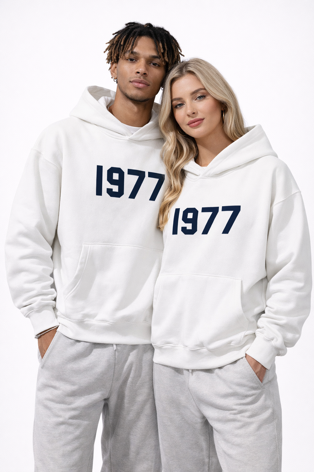 Man modeling men's vintage 1977 raglan sleeve hoodie. Casual streetwear pullover for urban fashion.