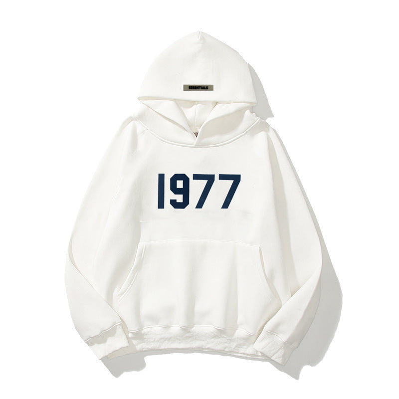 Vintage 1977 graphic print hoodie for men. Streetwear style, raglan sleeves, comfortable pullover.
