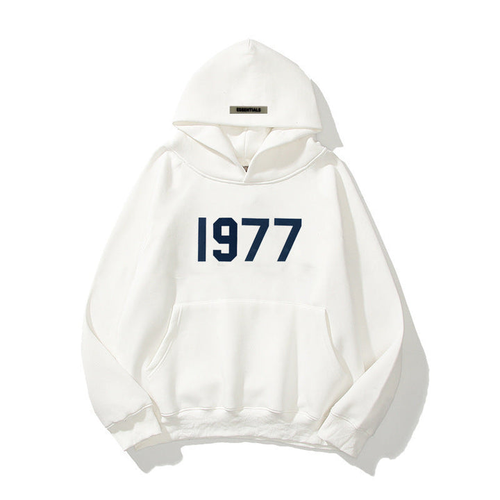 Vintage 1977 graphic print hoodie for men. Streetwear style, raglan sleeves, comfortable pullover.