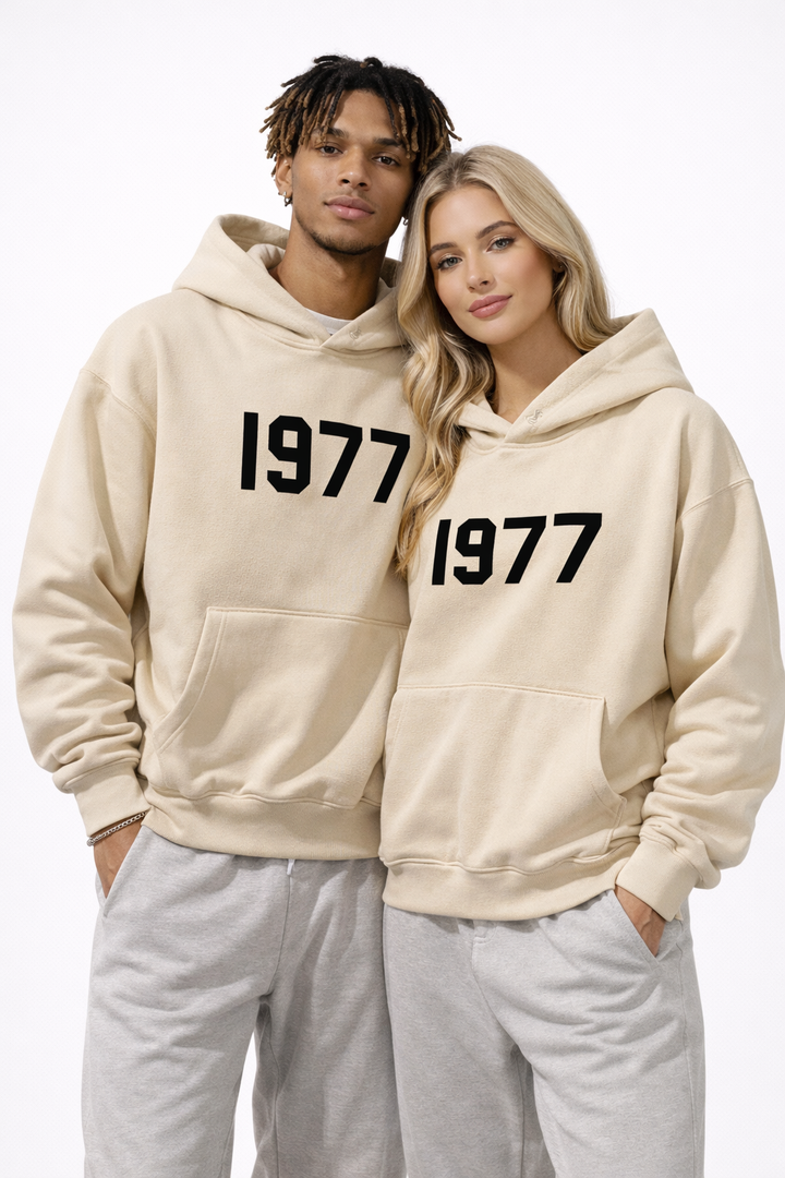 Full view of men's vintage 1977 streetwear hoodie. Raglan sleeves, comfortable, retro urban style.