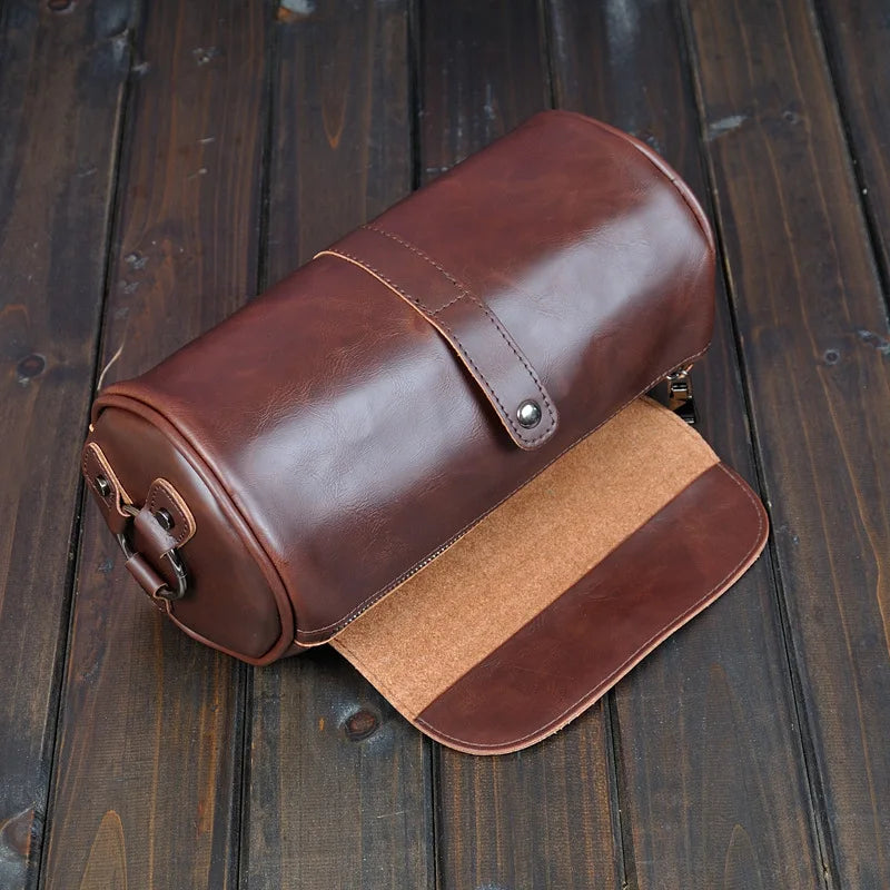 Premium men's vintage PU leather barrel shoulder bag, versatile crossbody for stylish daily use.