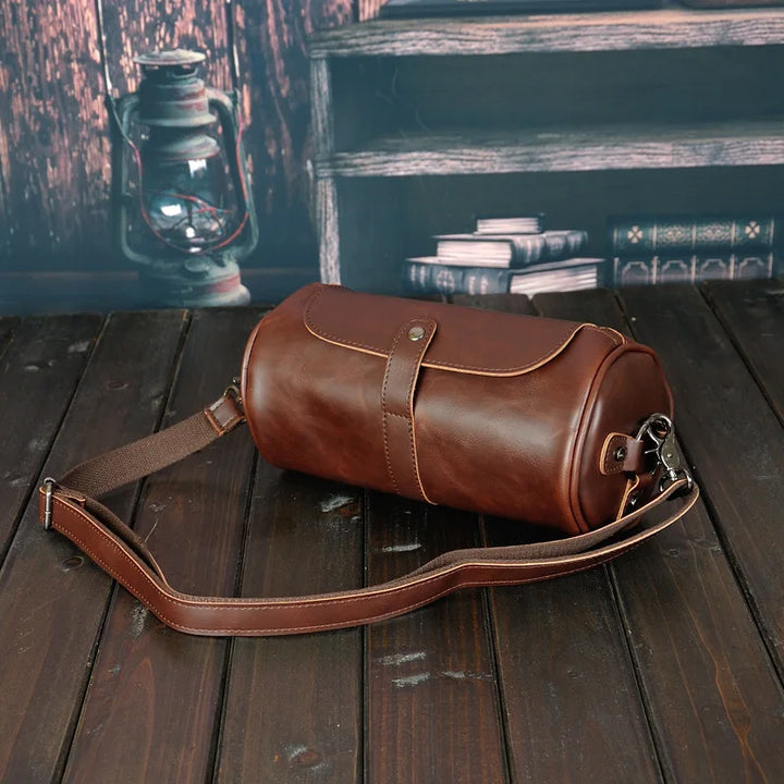 Stylish vintage men's PU leather barrel shoulder bag, ideal crossbody for daily essentials.