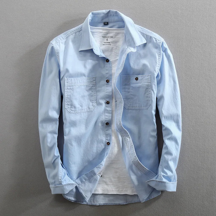 Durable men's vintage urban button-up shirt. Casual everyday wear with stylish dual chest pockets.