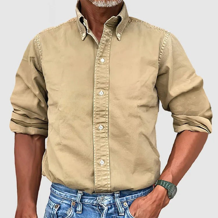 Comfortable men's relaxed fit button-down shirt with vintage wash, ideal for all-season casual wear.