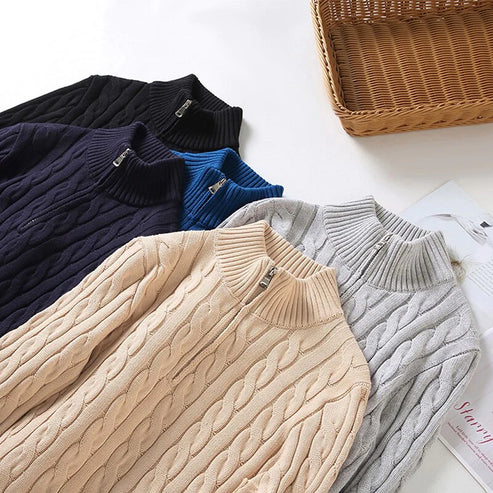 Close-up of men's textured half-zip pullover sweater, showcasing the warm winter knit.