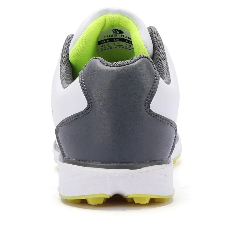 Performance men's golf shoes, waterproof, with fixed spikes for ultimate grip on the course.