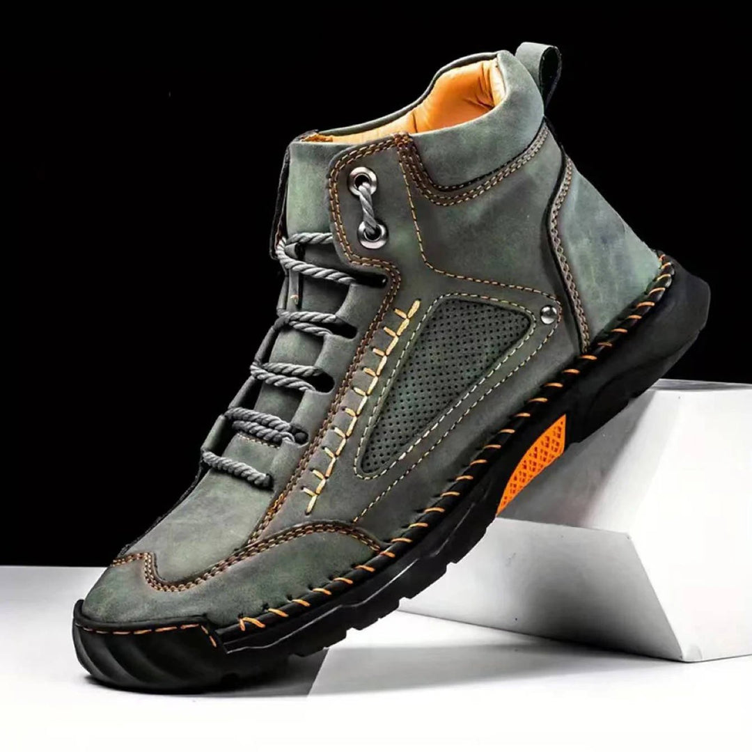 Men's grey waterproof hiking boots, engineered for all-season comfort and superior trail performance.